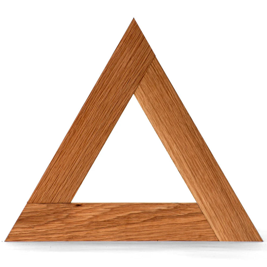 Wooden triangle trivet frame on a white background