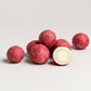 Nomu Noms Raspberry & Beetroot White Choc Coated Macadamias 50g